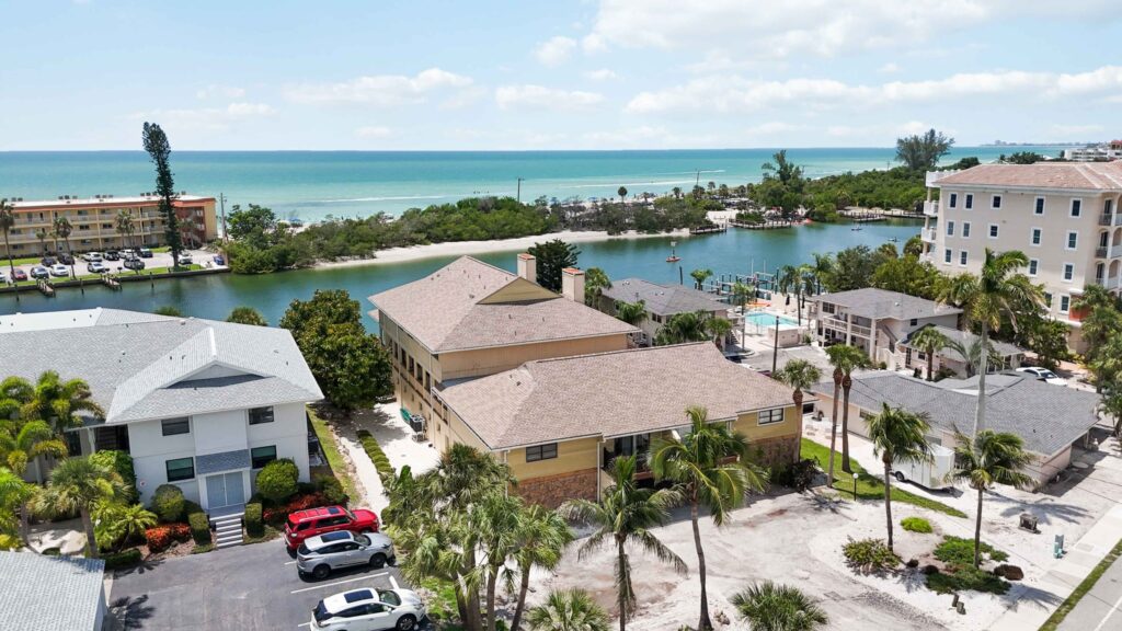 Aerial view of the property with Siesta Key's beach and turquoise Gulf waters in the background